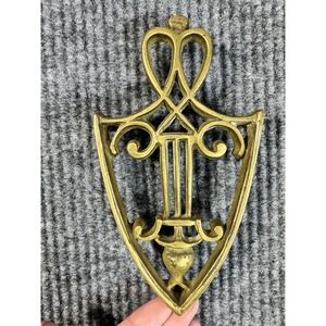 Antique Brass Shield Trivet with Scroll Pattern, Gold, 8x4 in